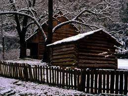 LOG CABIN IN THE SNOW