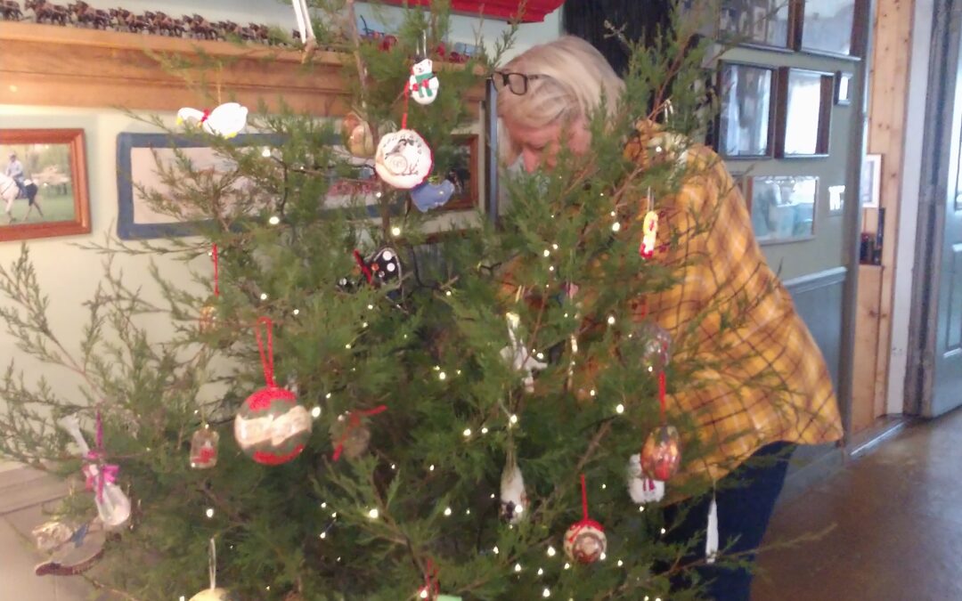 Woman decorating Christmas tree